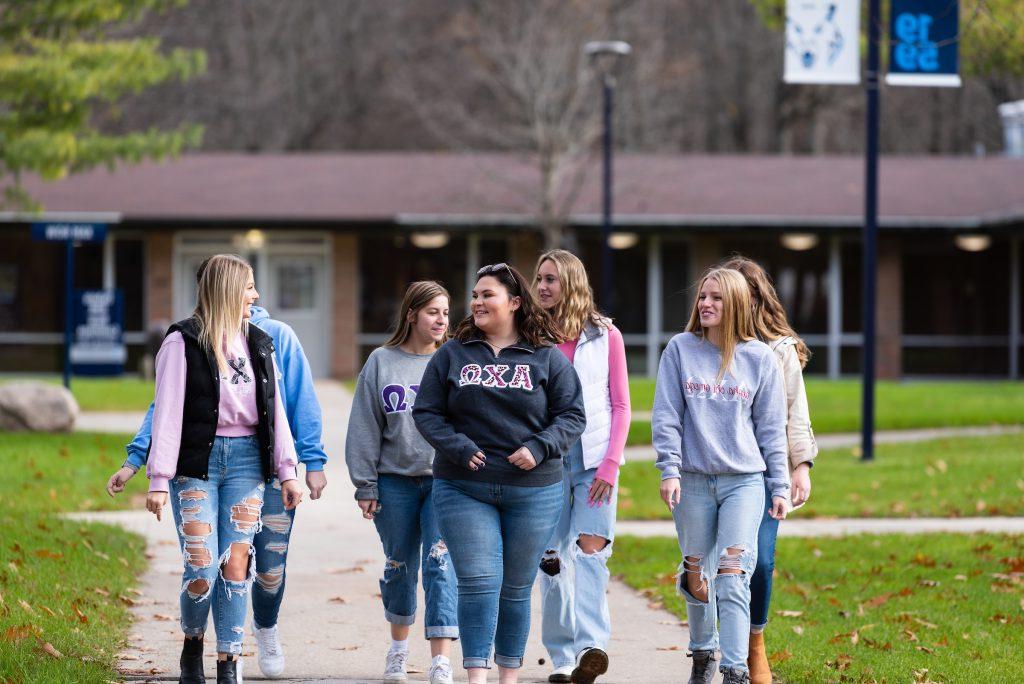 Alpha Chi Omega sisters walking through campus